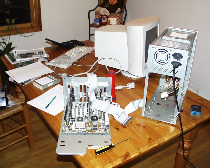The old system's case opened up, showing the internal components