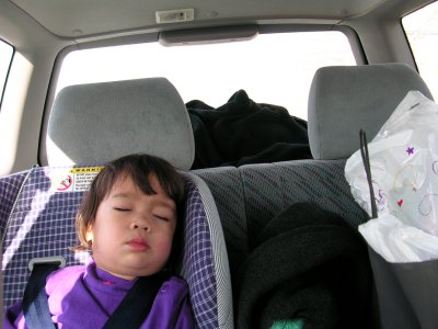 Mia sleeping in the car seat