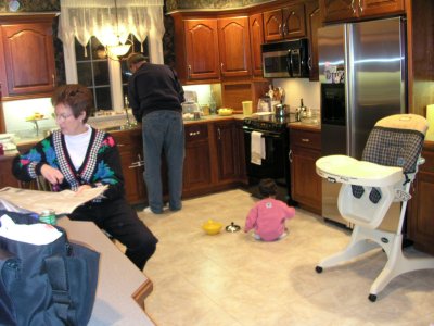 Mia playing in the Grand-Mom and Larry's kitchen