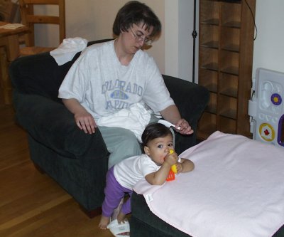 Mom combing Mia's hair