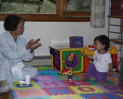 Mia stacking blocks for Grand Mom