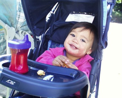Mia outside in her carriage