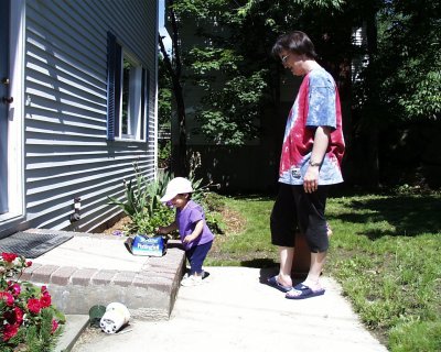 Mia outside standing with Mom