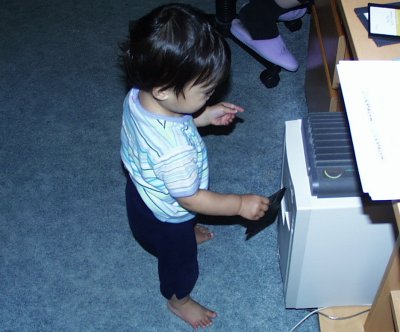 Mia standing with floppy disk