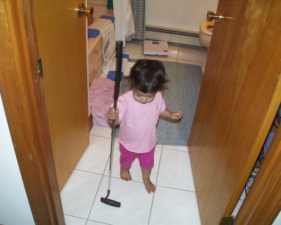 Mia with putter