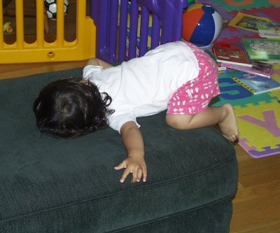 Mia hanging on the ottoman