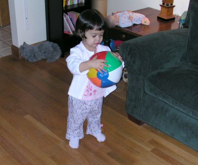 Mia with a ball in her baby shower outfit