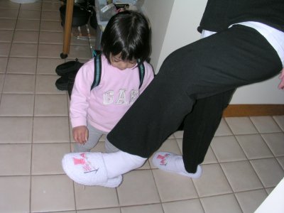 Mia playing with Mom's slippers