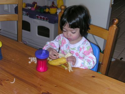 Mia eating a banana