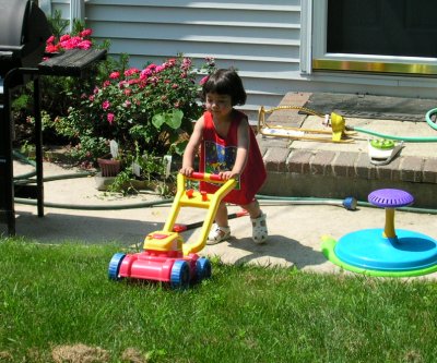 Mia mowing the lawn