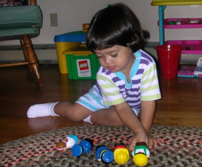 Mia and her toys laid out