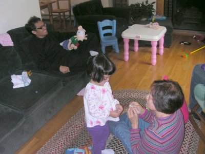 Mia and Grand Mom, with Uncle Renato on the sofa