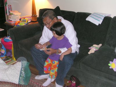 Mia and Grand Dad, eating bread