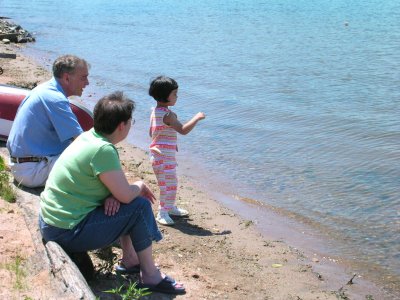 Mia at the lake with Grand Pop and Mom