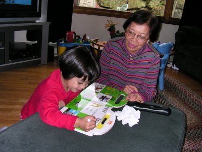 Mia showing Lola her letters book