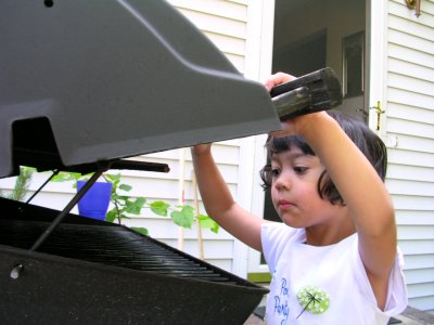 Mia peeking at the grill