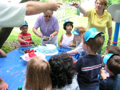 Mia waiting for cake at Victor's party