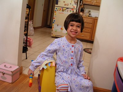 Mia at her desk smiling