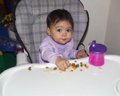 Mia eating her finger foods