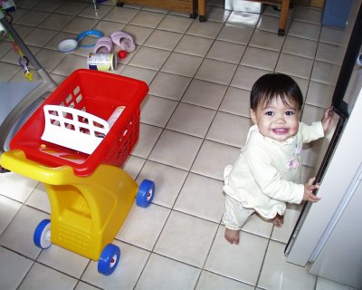 Mia by the fridge smiling