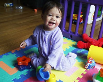 Mia laughing on floor