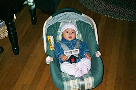 Mia in her car seat