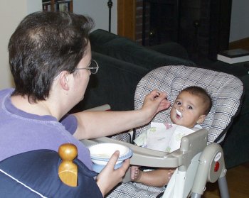 Mia Getting Fed Cereal