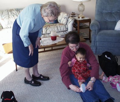 Mia getting dressed with Gram (Thanksgiving 2001)