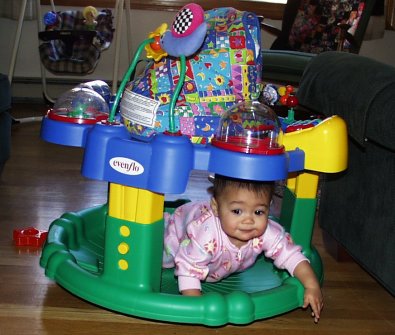 Mia crawling into her saucer