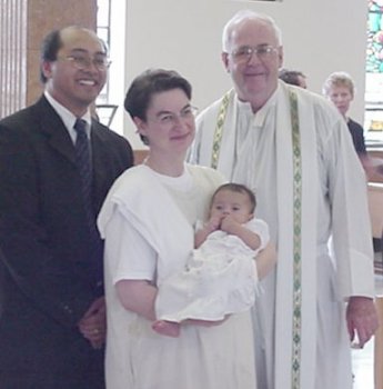 Mia with Parents at Baptism
