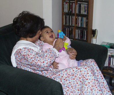 Mia laughing with Grandma